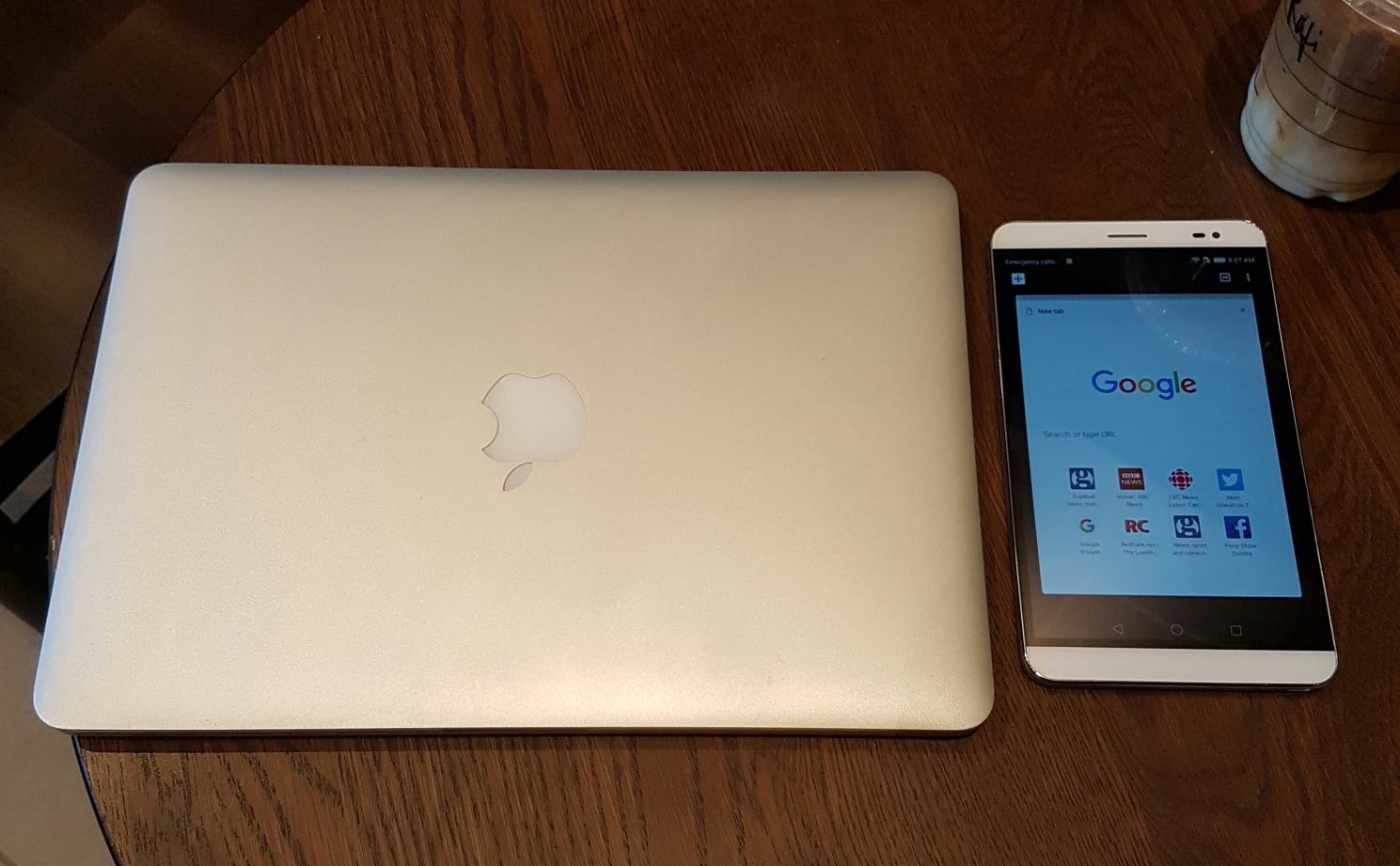 Macbook Pro next to Huawei phone